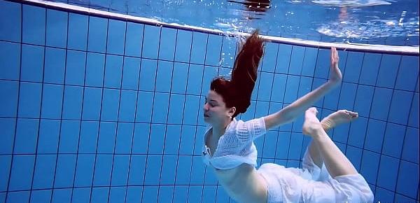  Redhead Marketa in a white dress in the pool